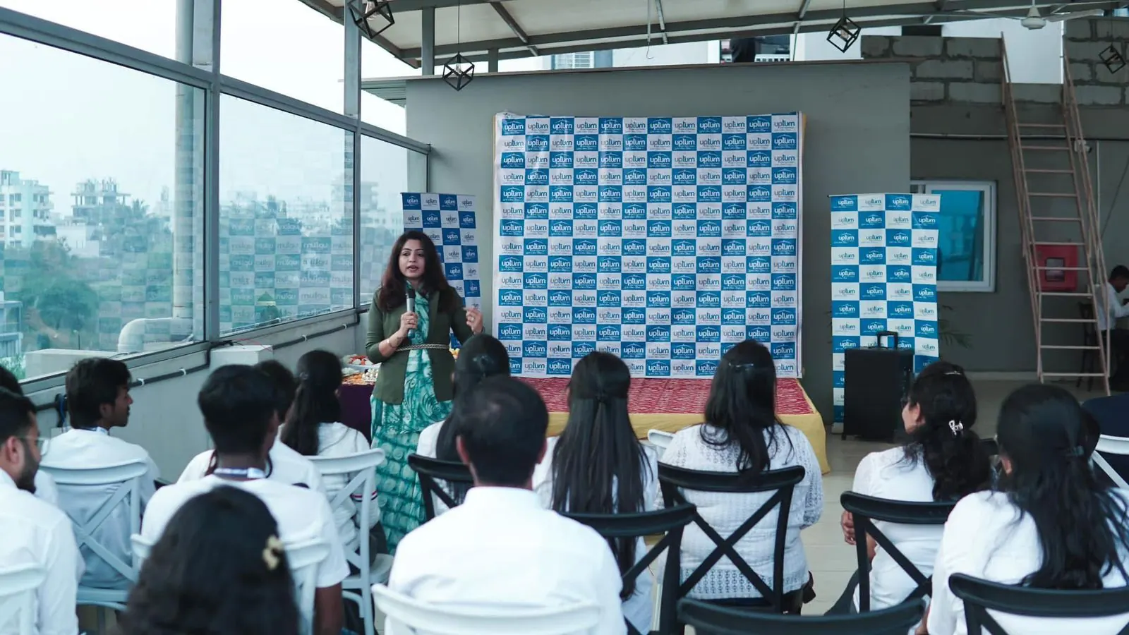 Sayali training a seated audience